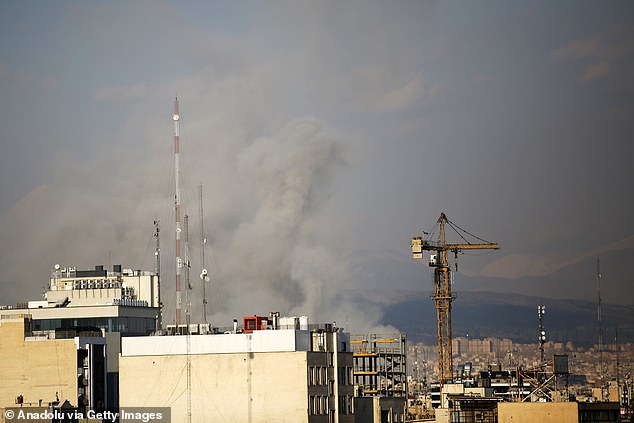 Smoke rises over a residential area following the US and Israeli strike in Tehran, Iran on Wednesday