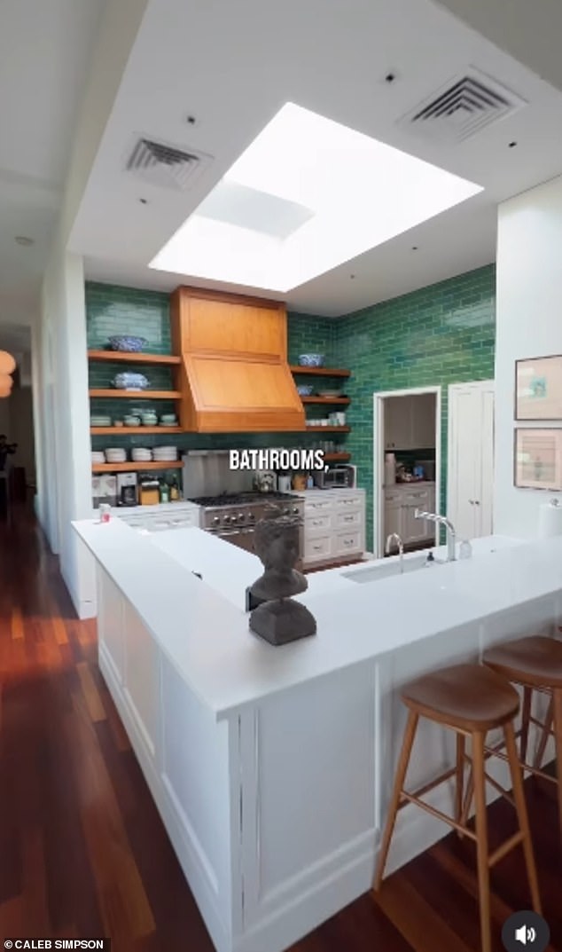 Green tile offers a pop of color to the airy space