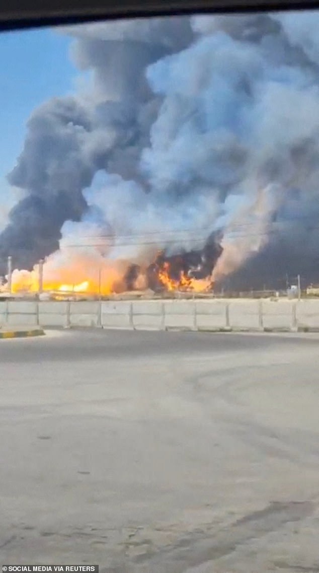 Smoke and fire rise near the South Pars gas field following an attack, amid the US-Israeli conflict with Iran, in Bushehr Province, Iran, March 18