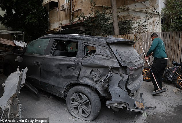 Municipal teams carry out cleanup and debris removal operations after missile fragments from retaliatory strikes launched from Iran hit parts of Tel Aviv, Israel, causing damage to nearby buildings and vehicles as sirens sounded across the city, on April 1