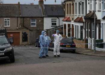 Woman in her 80s stabbed to death outside her home as man in his 60s arrested on suspicion of murder