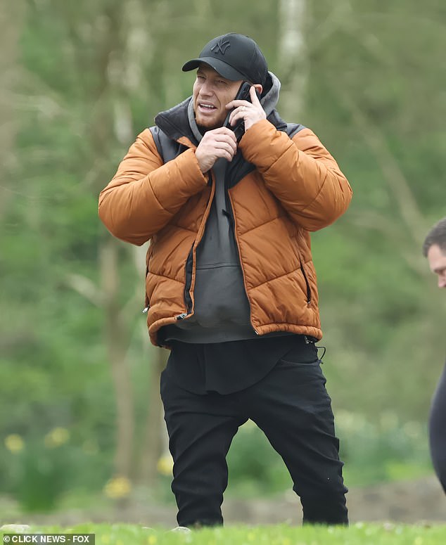 Joe's ring was on as he took time out to take a call during the day out to celebrate the birthday of Stacey's sister Jemma's daughter