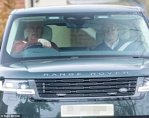 Andrew was pictured behind the wheel of his Range Range wearing a maroon cable-knit jumper, with his security guard next to him in the passenger seat