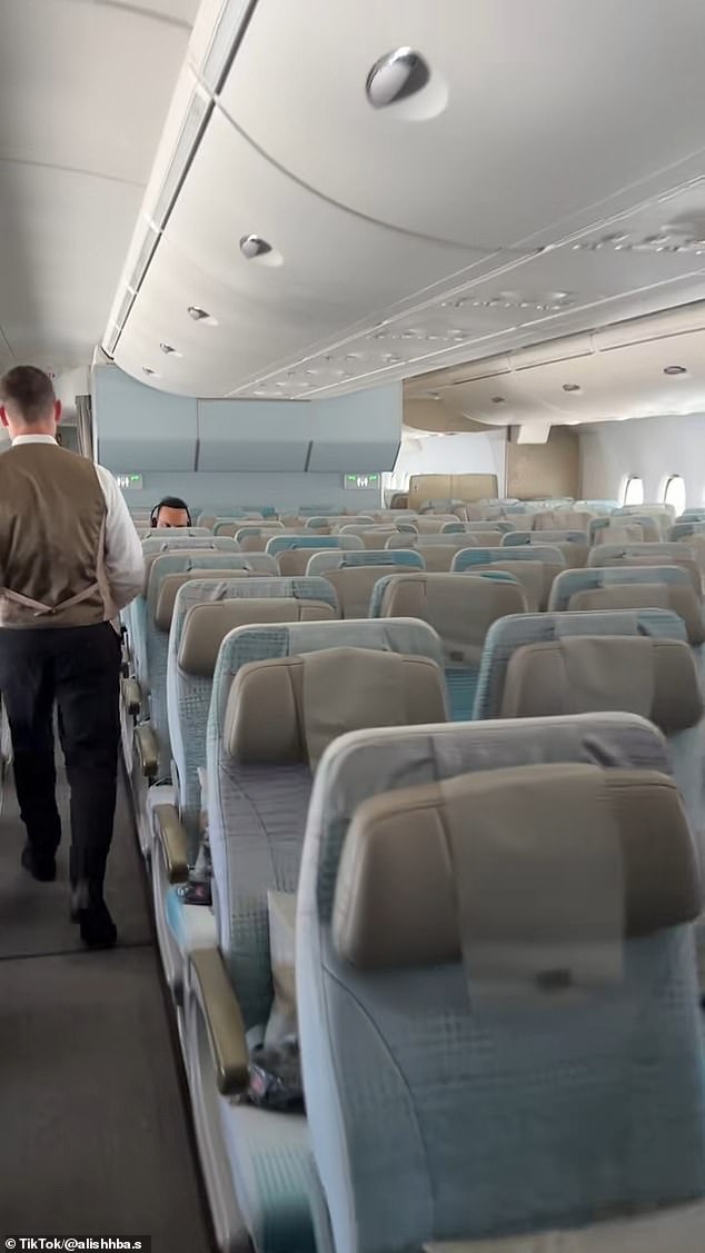 Flights to Dubai have been pictured with rows of empty seats, as at least five planes parked at airports in the Middle East have been hit by Iran
