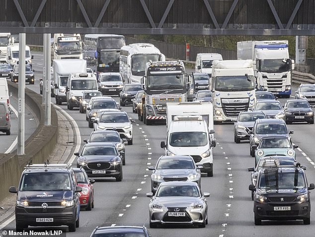 Heavy traffic is seen on the M25 near Egham in Surrey as many travellers' Easter getaway begins - with motoring organisations predicted this year's would be the busiest since 2022