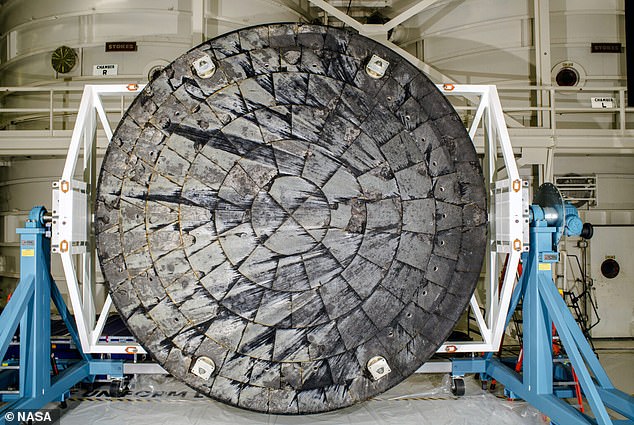 The most dangerous moment will occur during re-entry, as Orion's heatshield is subjected to enormous temperatures due to friction with the atmosphere. Pictured: Orion's heatshield after re-entry during Artemis I