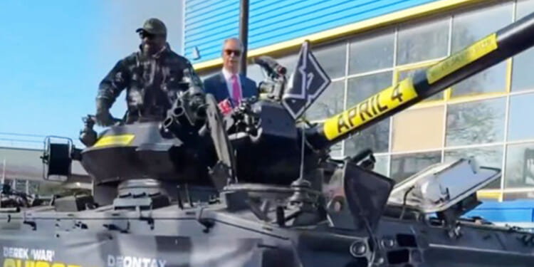 Derek Chisora rocks up at press conference in a TANK flanked by Nigel Farage ahead of retirement bout vs Deontay Wilder
