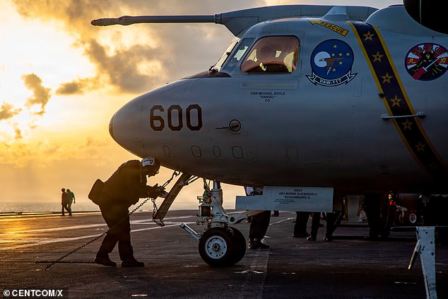 An E-2D Advanced Hawkeye prepares to launch from USS Abraham Lincoln (CVN 72) during Operation Epic Fury