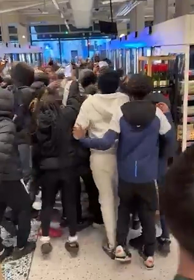 A mob of teenagers took over a Marks and Spencer food hall in Clapham on Saturday