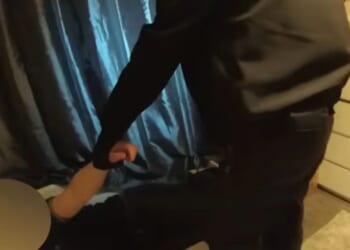 Moment dozy 'burglar' is hauled out of child's bed after falling asleep while breaking into home