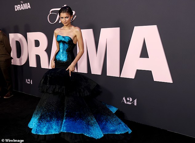 Zendaya finalized the look with matching blue heels featuring feather details