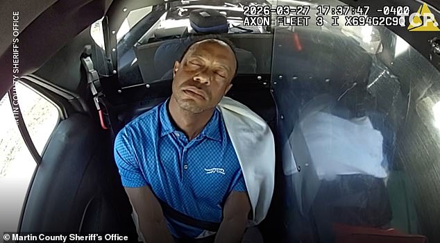 Woods appeared to drift off during the short ride to the police station in Martin County