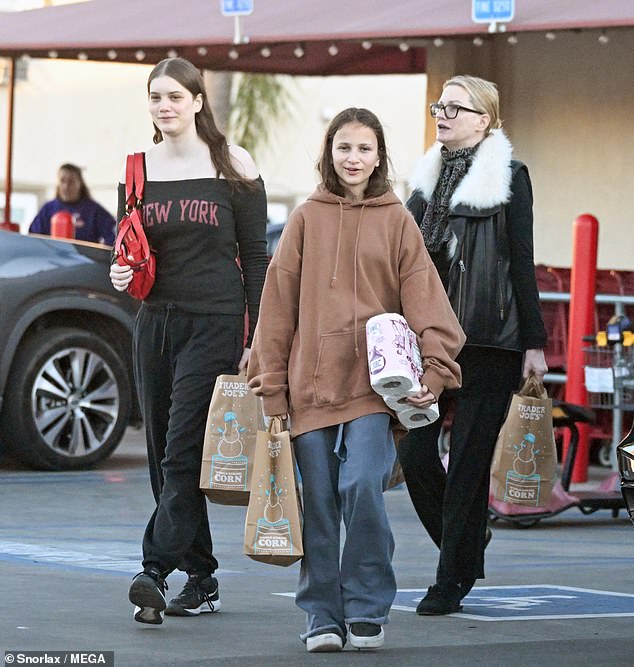 Evans out shopping in Los Angeles with her daughters, Ella, 16, and Elsie, 12, in December