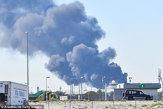 Smoke rises after an Iranian drone attack struck fuel tanks at Kuwait International Airport on Monday