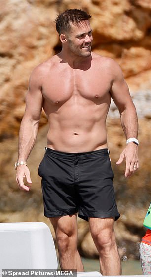 Alongside their kids Theodore, seven, Gigi, five, and Otto, three.