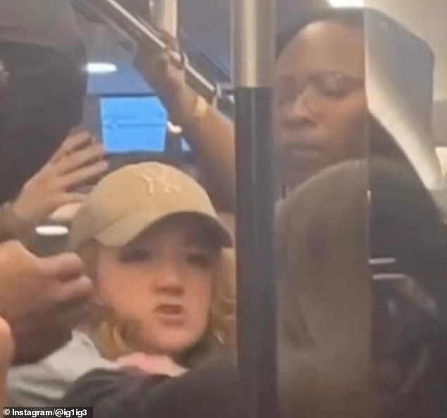 After the man says to her 'don't smoke in the middle of the train', she tells him to 'f*** off'