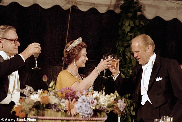 President Gerald Ford (right) toasts Queen Elizabeth (center) alongside Vice President Nelson Rockefeller (left) under a tented Rose Garden at the royal's bicentennial state visit in 1976