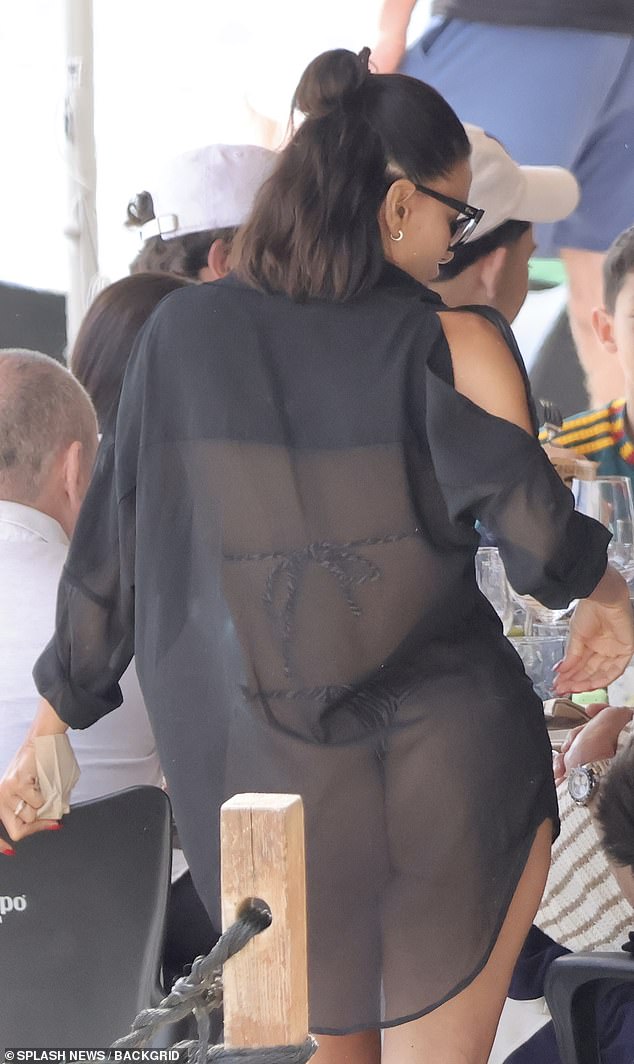 The Desperate Housewives star sizzled in a tiny string bikini paired with a barely-there black cover-up that looked more like a sheer shirt than a traditional beachwear piece