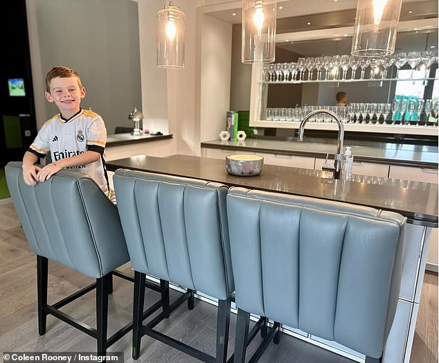 Another room in the house is dominated by a large island with a  marble countertop, with the couple going for wooden flooring