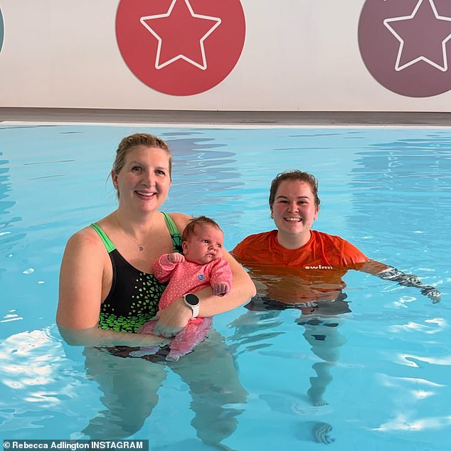 In a new update, Rebecca, who looked incredible in a black and green swimsuit, was all smiles as she cradled her baby girl in the swimming pool