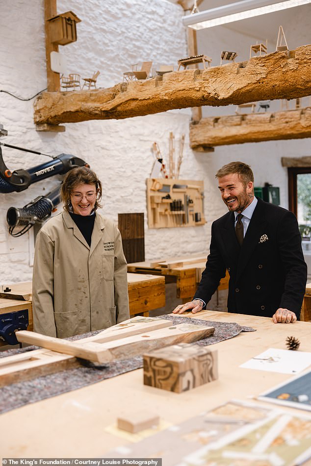 Sir David Beckham at The King's Foundation Snowdon School of Furniture with graduate Eleanor