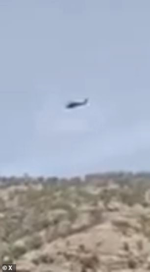 A US helicopter searches the region