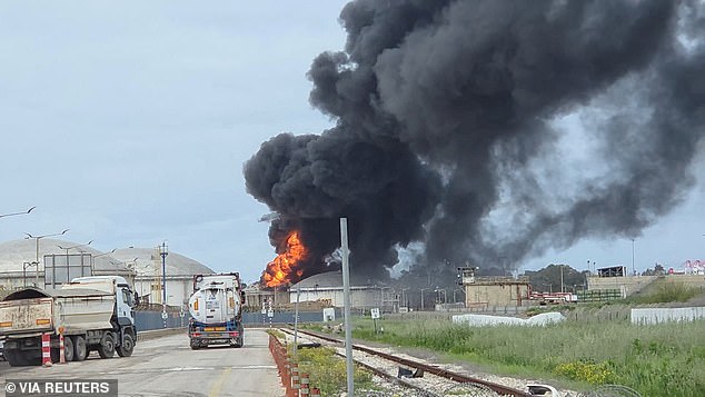 A blaze in Haifa after Israel's Fire and Rescue Service said that an industrial building and a fuel tanker at Israel's Oil Refineries were hit by debris from an intercepted Iranian missile
