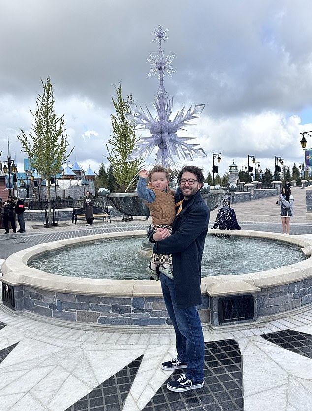 Ben and his two-year-old son Theo at beside the fountain in the recreated Arendelle