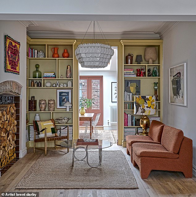 In the lounge area Lisa uncovered the original fireplace – used as log storage – and framed it with Purple Brown square gloss tiles from Bert & May. The pendant light is from Original BTC and the in-built bookcases are painted in Wheatsheaf by Mylands. ‘It makes the room always feel sunny, even in York!’ says Lisa.