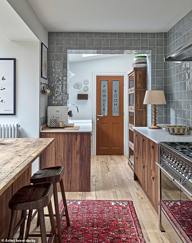In the kitchen, Lisa opened up the original narrow doorway to create more space. The worktops are by Caesarstone and the cabinets are from Howdens. ‘It’s a mix and match of luxe with budget,’ says Lisa. The ‘Powder Room’ door is painted in Cigar by Mylands.
