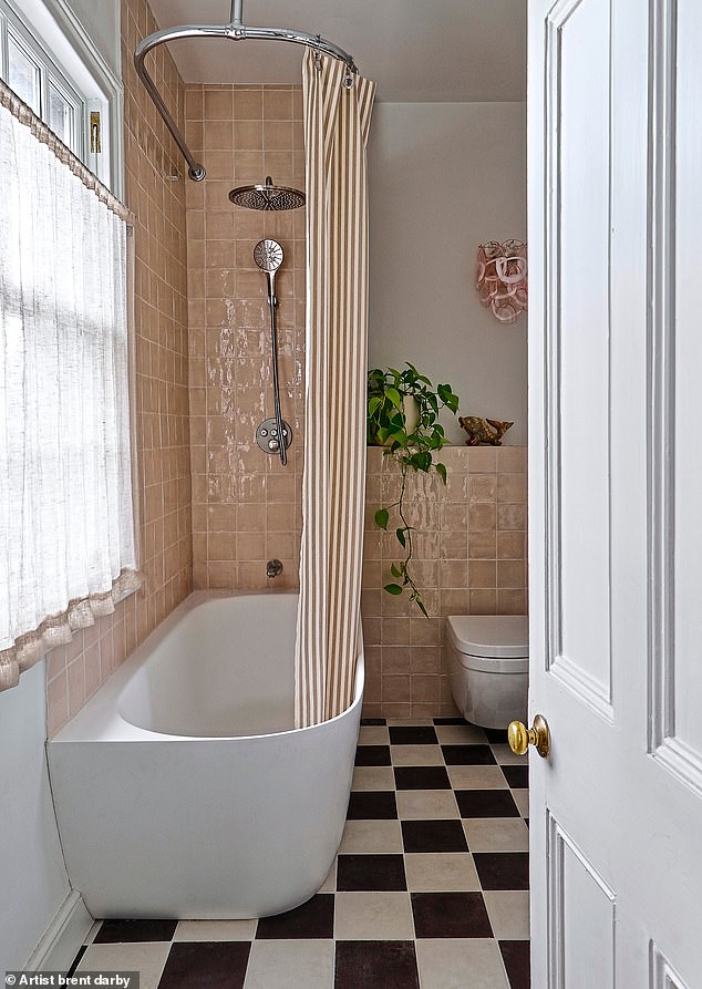 The bathroom is the ‘girliest’ room in the house, with pink gloss tiles and a striped linen shower curtain from Ferm Living. Monochrome chequerboard floor tiles from Bert & May stop the overall look from becoming too sugary.