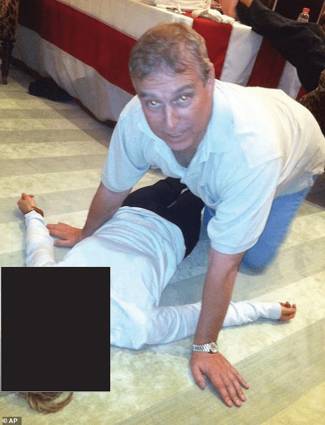 The former Prince Andrew is alleged to have had sex with Virginia Giuffre when she was just 17 (Here, he is pictured leaning over an unidentified person in the files)