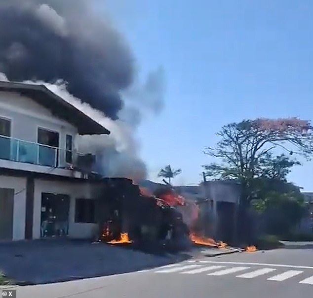 The burnt out remains of the restaurant were attended by emergency services but all four passengers in the jet were killed