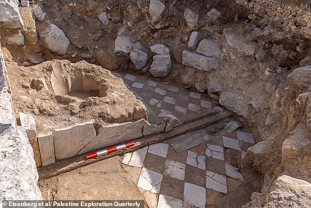 The small hall and the baptismal font in its corner, faced with decorated marble slabs with an inlaid marble floor