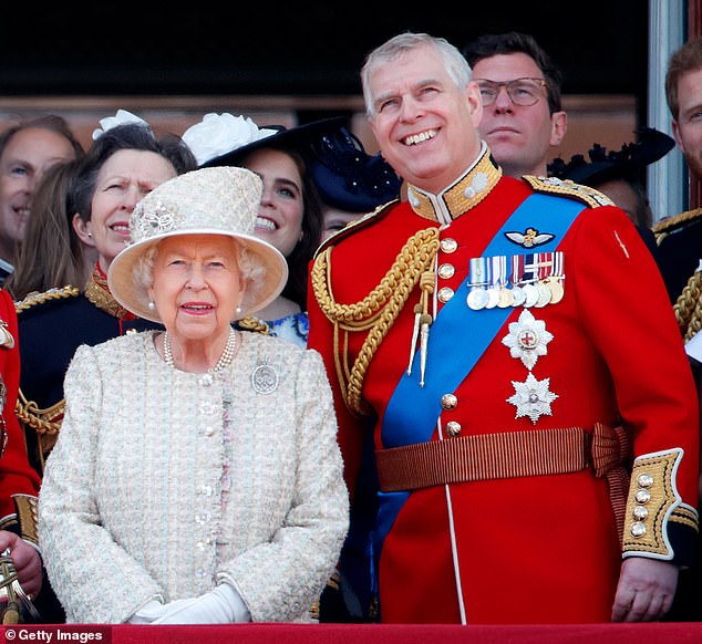 Mother and son look skyward as a flypast soars over Buckingham Palace in 2019 for Trooping the Colour