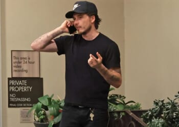 Brooklyn Beckham appears to take tense phone call during day out with wife Nicola Peltz amid ongoing family feud