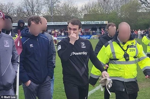 Wright (centre) was not sent off but was given a security escort off the pitch after full-time