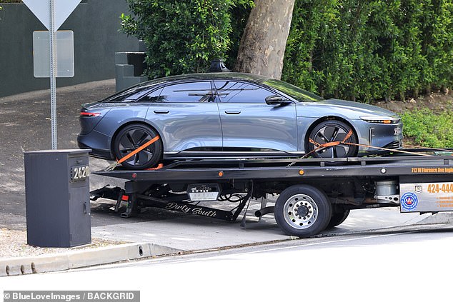 The electric Lucid Air vehicle was seen being hauled away on a flatbed trailer