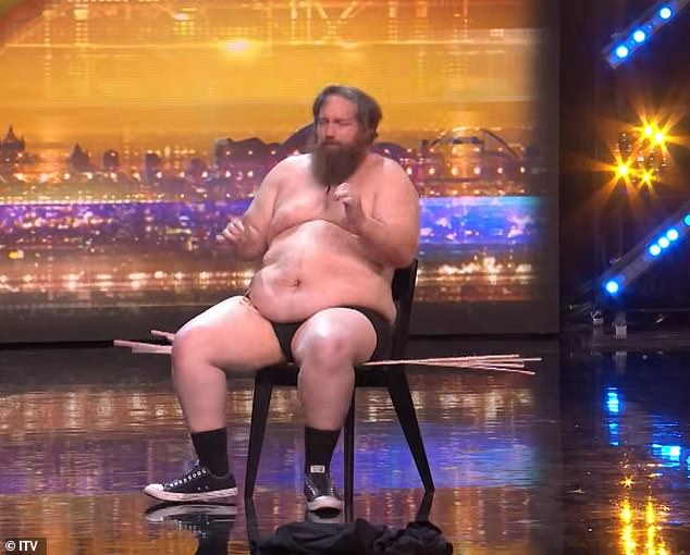 During the act, Leroy sat directly on a chair covered in a pile of strips studded with hundreds of sharp, angled nails