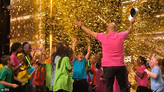 She then stopped talking and sat back, before standing up and smashing the golden buzzer - sparking screams from the kids on stage