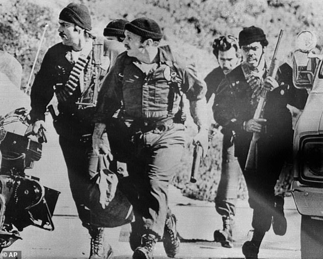 In fewer than three minutes, five had been shot. Meanwhile, more and more pupils were arriving, unaware of the threat. Pictured: A SWAT team runs to the scene of the shooting in January 1979