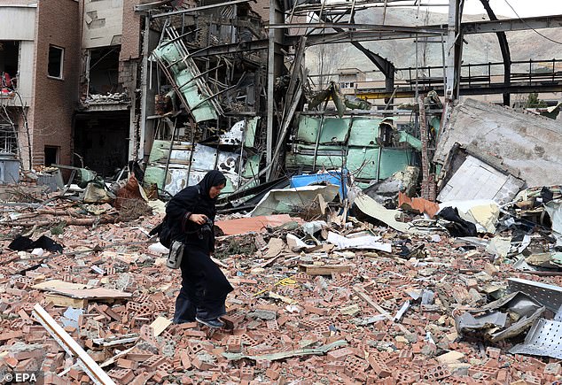 The conflict was launched just over six weeks ago (pictured: woman walks in debris after US-Israeli airstrike on the Shahid Beheshti University in Tehran)