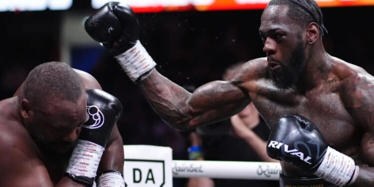 Deontay Wilder suffers suspected broken hand in Derek Chisora fight and claims he 'held back' from going for KO