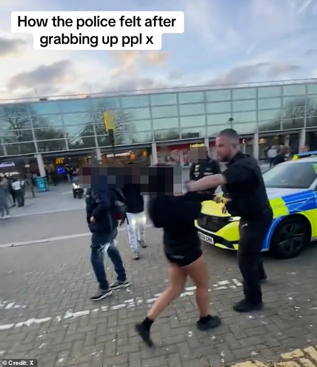 Footage posted on social media shows officers in a stand off with a large group of youths in tracksuits outside Midsummer Place shopping centre in Milton Keynes yesterday evening