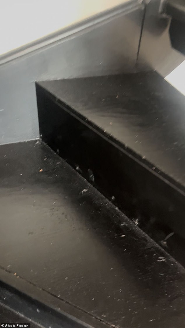 The wooden stairs, which would have been a characterful feature of the property, are dusty and unclean