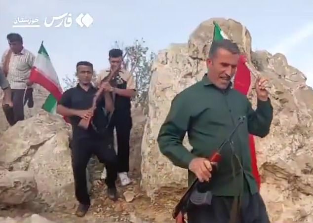 Following the crash, Iranian military forces put a $60,000 bounty on the airman's head, prompting Iranian militants to hunt for him in the mountains. (Pictured: Bakhtiari tribes in Khuzestan headed into the mountains, rifles in hand, searching for the missing American F-15 jet pilot)