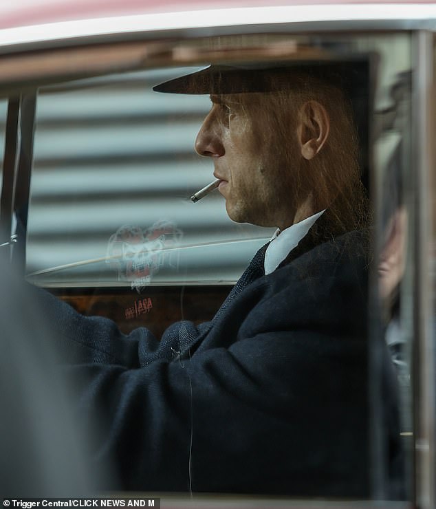 He could be seen looking deep in thought as he puffed on a cigarette in one scene