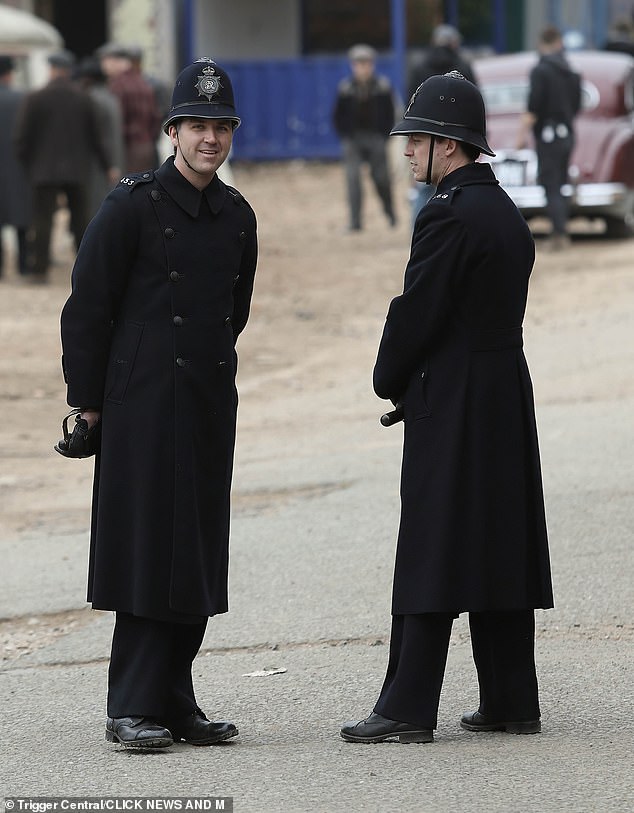 The set had been decorated for the time period with fellow actors also in their costumes with many dressed as policemen, suggesting there was much ahead for Jamie's character