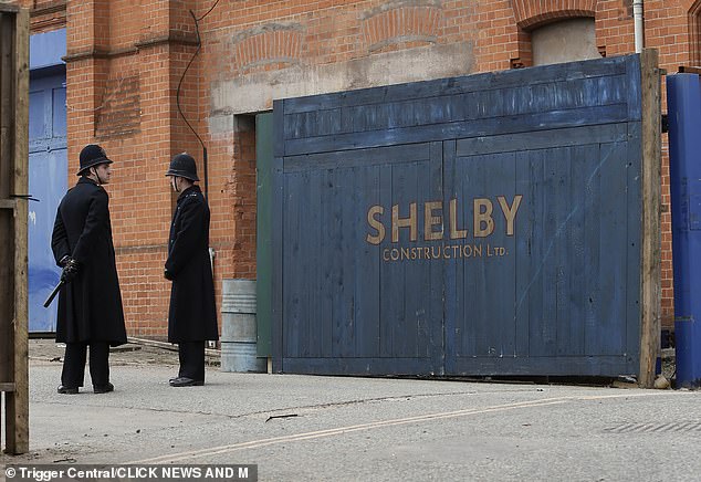 The actor was spotted filming the outdoor scenes which saw his character arriving in a jaguar at a building marked 'Shelby Construction'