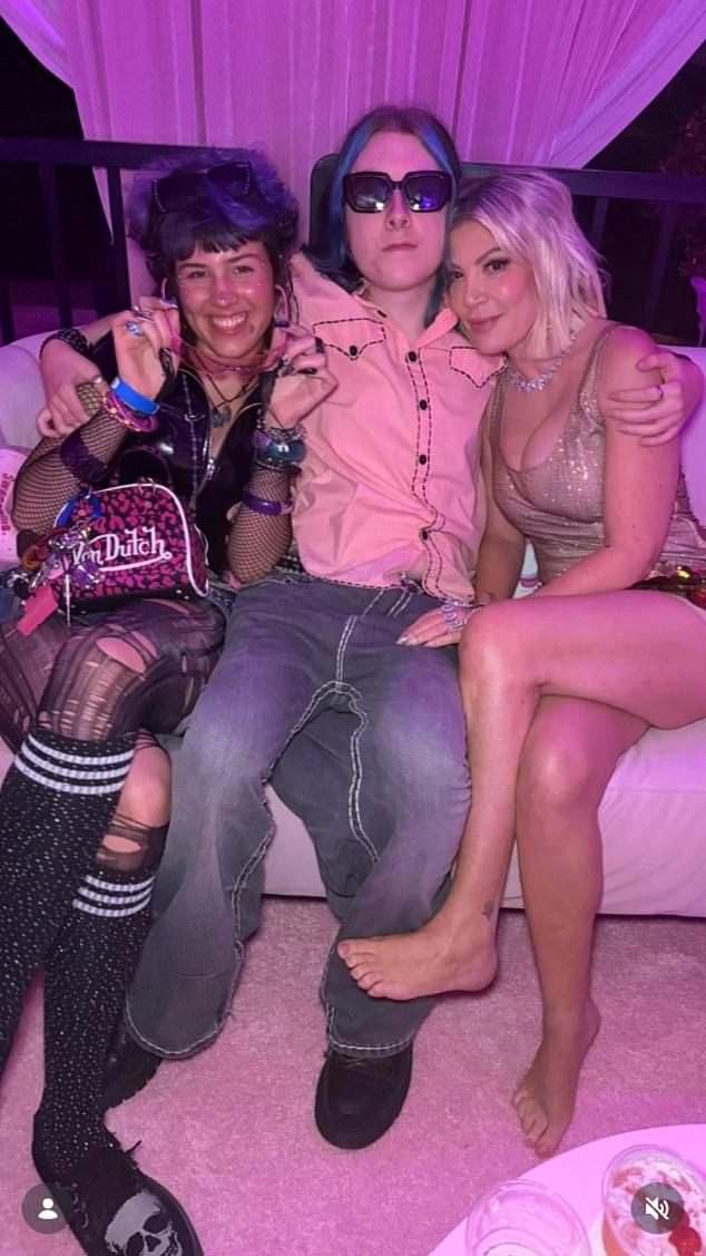 The only ones seen in the eyewitness-captured footage were Spelling, her 13-year-old son Finn, her 19-year-old son Liam McDermott (center, pictured in March) and his girlfriend Silvana de Luca (L)